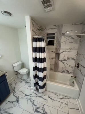 Shower, hair dryer, towels, soap