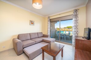 TV - 1-Bedroom Apartment with Garden View, Shared Pool, Wi-Fi & Air Conditioning (Porches)