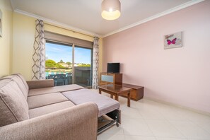 TV - 1-Bedroom Apartment with Garden View, Shared Pool, Wi-Fi & Air Conditioning (Porches)