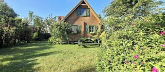 Summer house made of wooden beams