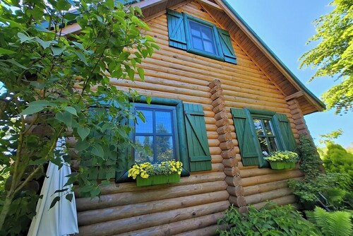 Summer house made of wooden beams