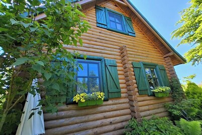 Summer house made of wooden beams