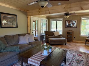 TV, fireplace, books - Cullasaja River Cabin—Peaceful Retreat with Hot Tub & Grill (Franklin)