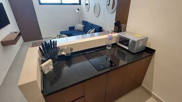 Fridge, microwave, stovetop, coffee/tea maker