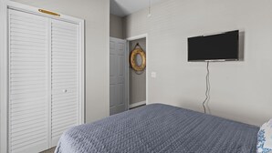 A bedroom with a bed, a white closet, a door with a towel ring, and a TV on the wall. - Top Floor Canal View TownHome - 3 BDRM Sleeps 8 with Linens (Carolina Beach)