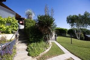 A residential property with a stone staircase, a fenced yard, and various plants. - Gîte le rêve: Between Lake and Mountains, Near Aix-les-Bains and Savoie Grand Revard (Viviers du Lac)