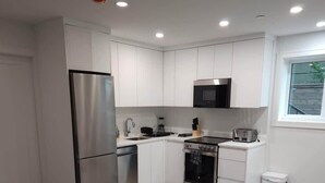 Coffee/tea maker, fridge, microwave, oven