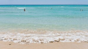 A beach with clear turquoise water and gentle waves. - Villa Saracena - Seven Bedroom Villa, Sleeps 14 (Costa Saracena - Castelluccio)