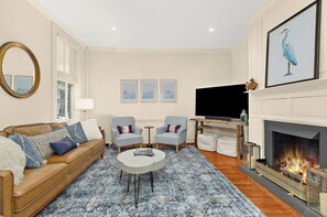 TV, fireplace, books