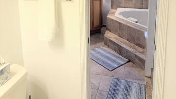 Jetted tub, hair dryer, towels, toilet paper