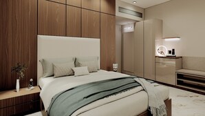 Un dormitorio moderno con una cama grande, paneles de madera, un tocador con espejo e iluminación empotrada en el techo.