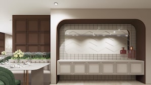 Una cocina moderna con isla integrada, zona de estar y un salpicadero decorativo.