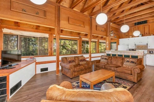 Open Living room with wood beam ceilings