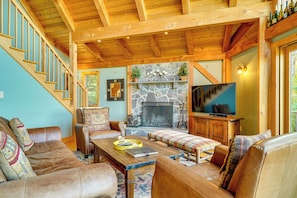 Televisio, takka, pöytätennispöytä, videokirjasto