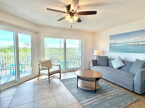 TV, stereo - Private balconies, Walk to Holmes Beach, sleeps 8, access to heated pool (Holmes Beach)