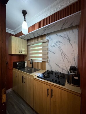 Microwave, stovetop - Luxury bedroom with modern bathroom, a fully equipped kitchen in Lekki Phase 1 (Lekki)