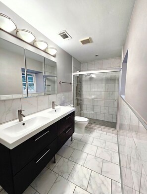 Shower, hair dryer, towels, soap