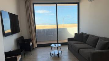 Apartment, 3 Bedrooms, Balcony, Garden View | Living room