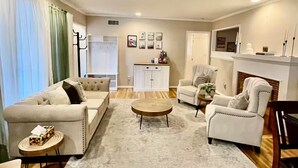 A living room with a sofa, armchairs, a coffee table, and a fireplace. - La Tranquil Escape: Secluded Los Angeles Oasis! (Los Angeles)