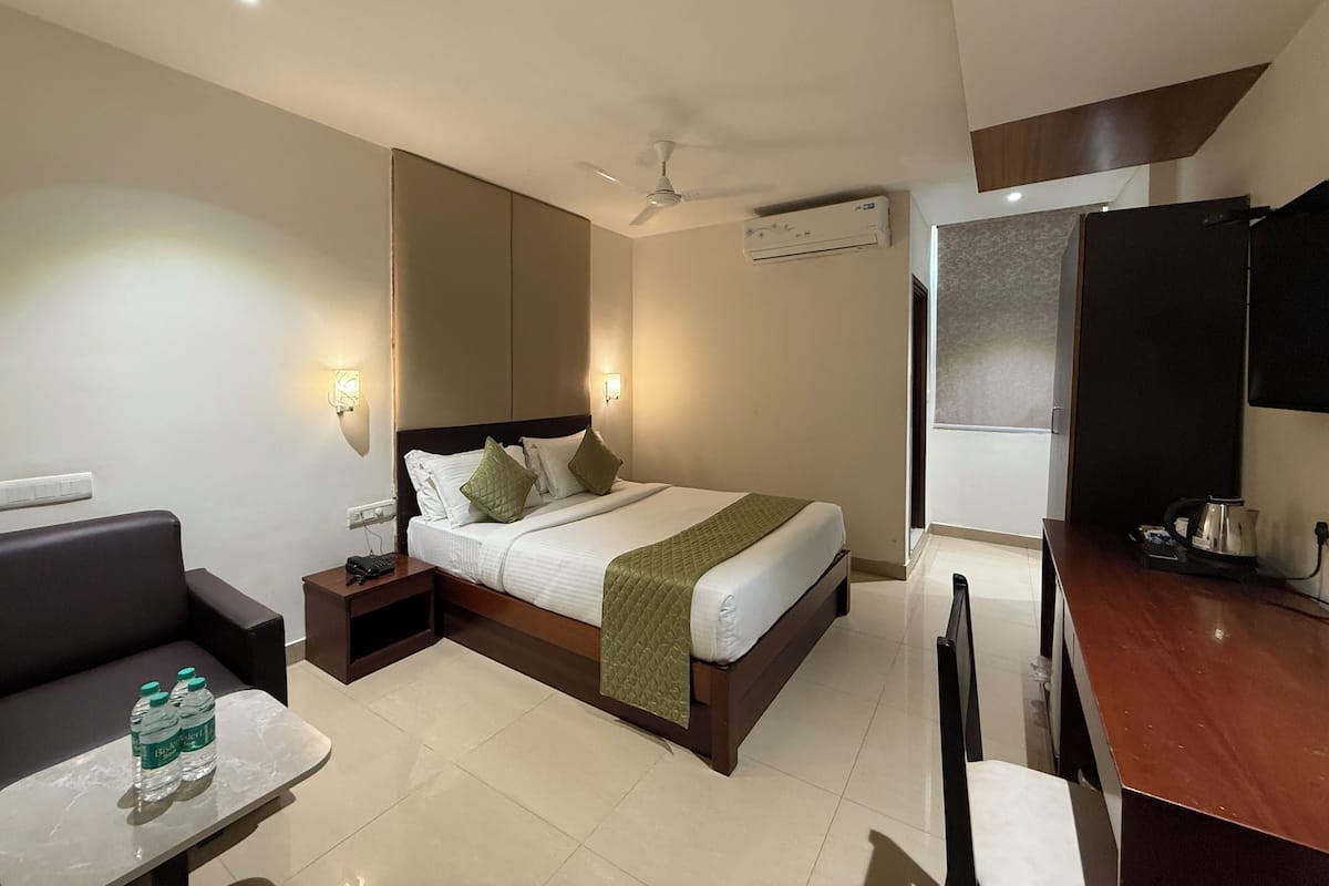 Premium Double Room, City View | In-room safe, desk, laptop workspace, blackout drapes