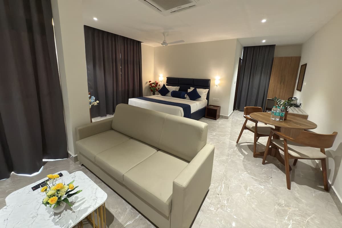 Luxury Suite, Balcony, City View | In-room safe, desk, laptop workspace, blackout drapes