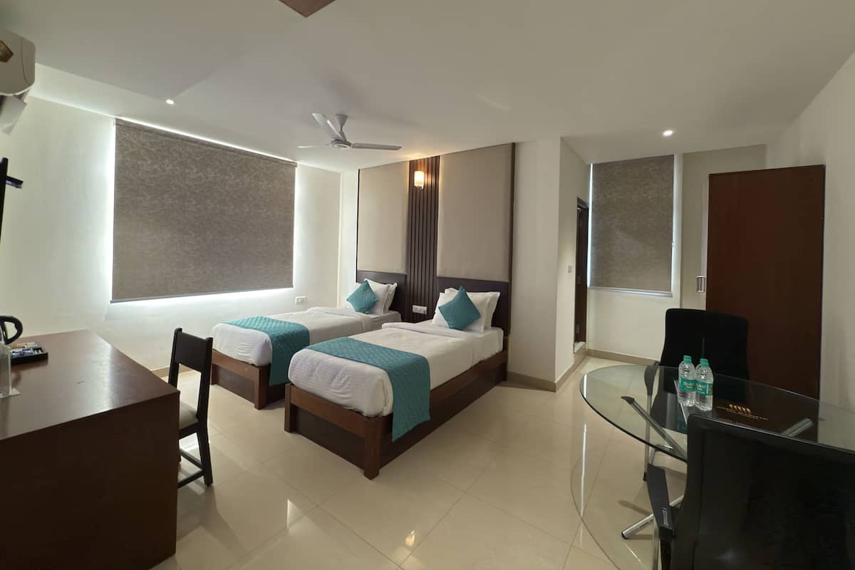 Business Twin Room, City View | In-room safe, desk, laptop workspace, blackout drapes