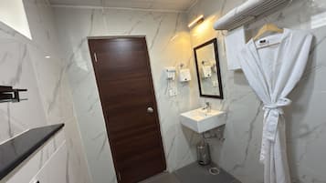 Luxury Suite, Balcony, City View | Bathroom | Shower, free toiletries, hair dryer, slippers
