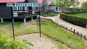 A resort with a sign reading "WE ❤️ WATER CITY RESORT".
