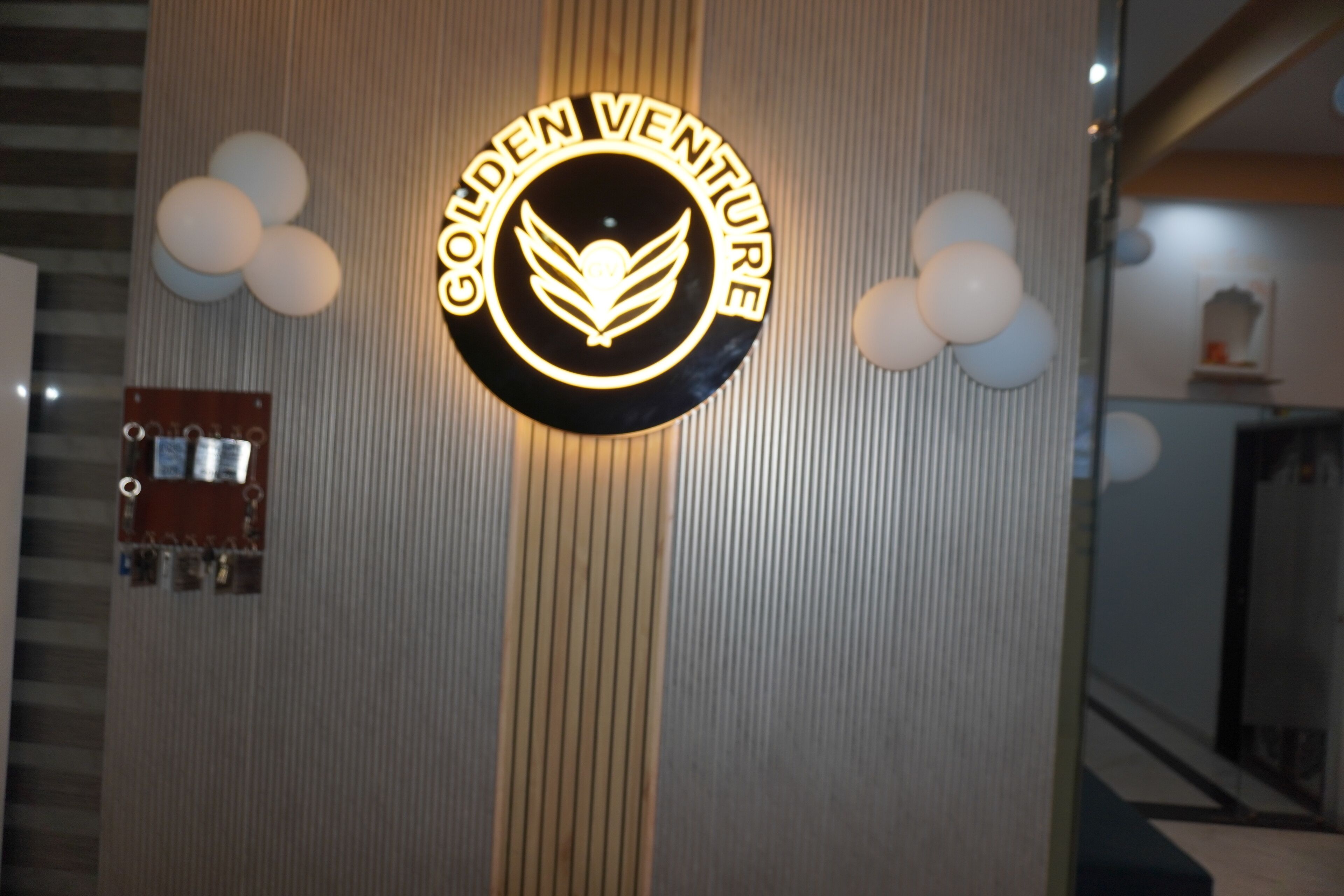 A wall with a circular sign that reads "Golden Venture."