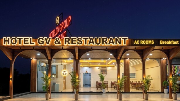 A hotel and restaurant with a sign reading 'HOTEL GV & RESTAURANT AC ROOMS Breakfast.' - Hotel GV Group and Restaurant (Khatoo)