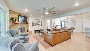 TV, fireplace, books