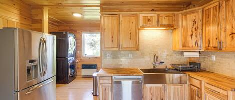 Fridge, stovetop, dishwasher, coffee/tea maker