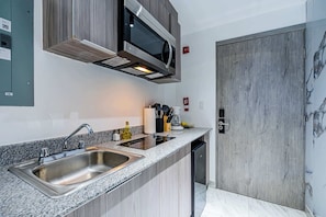 Fridge, microwave, stovetop, coffee/tea maker