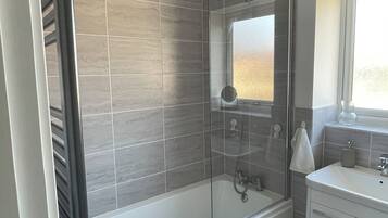 Shower, hair dryer, towels, soap