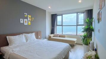 Deluxe Apartment, Balcony, Ocean View | Individually decorated, desk, laptop workspace, blackout drapes