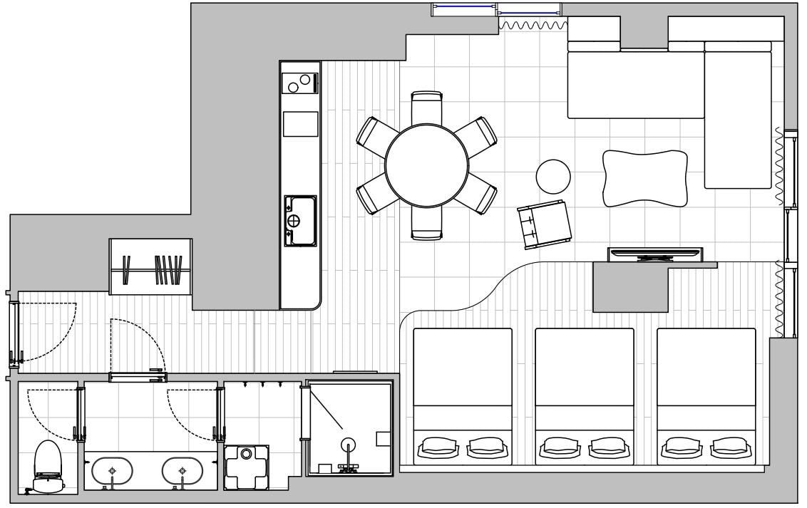 A hotel room layout with a dining area, a TV, and a bathroom.