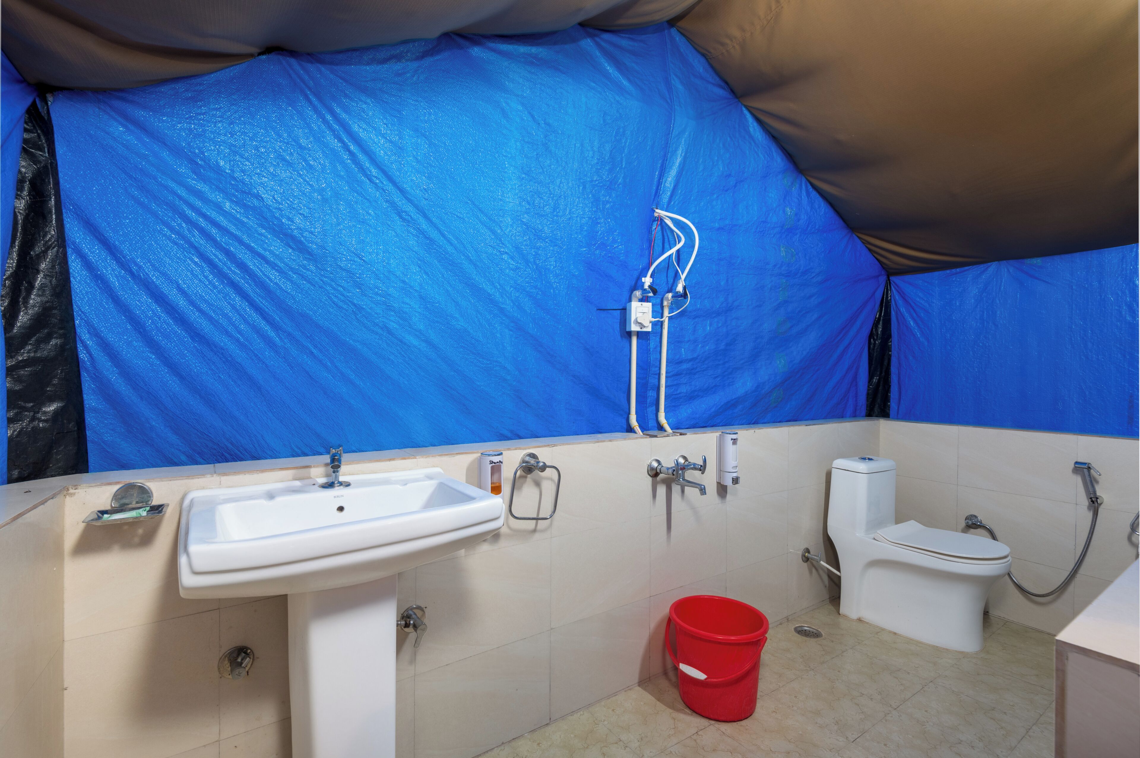 A bathroom with a sink, toilet, and shower.