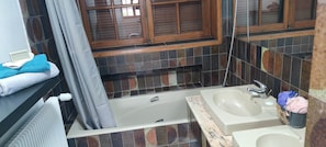 Combined shower/tub, hair dryer, towels, toilet paper