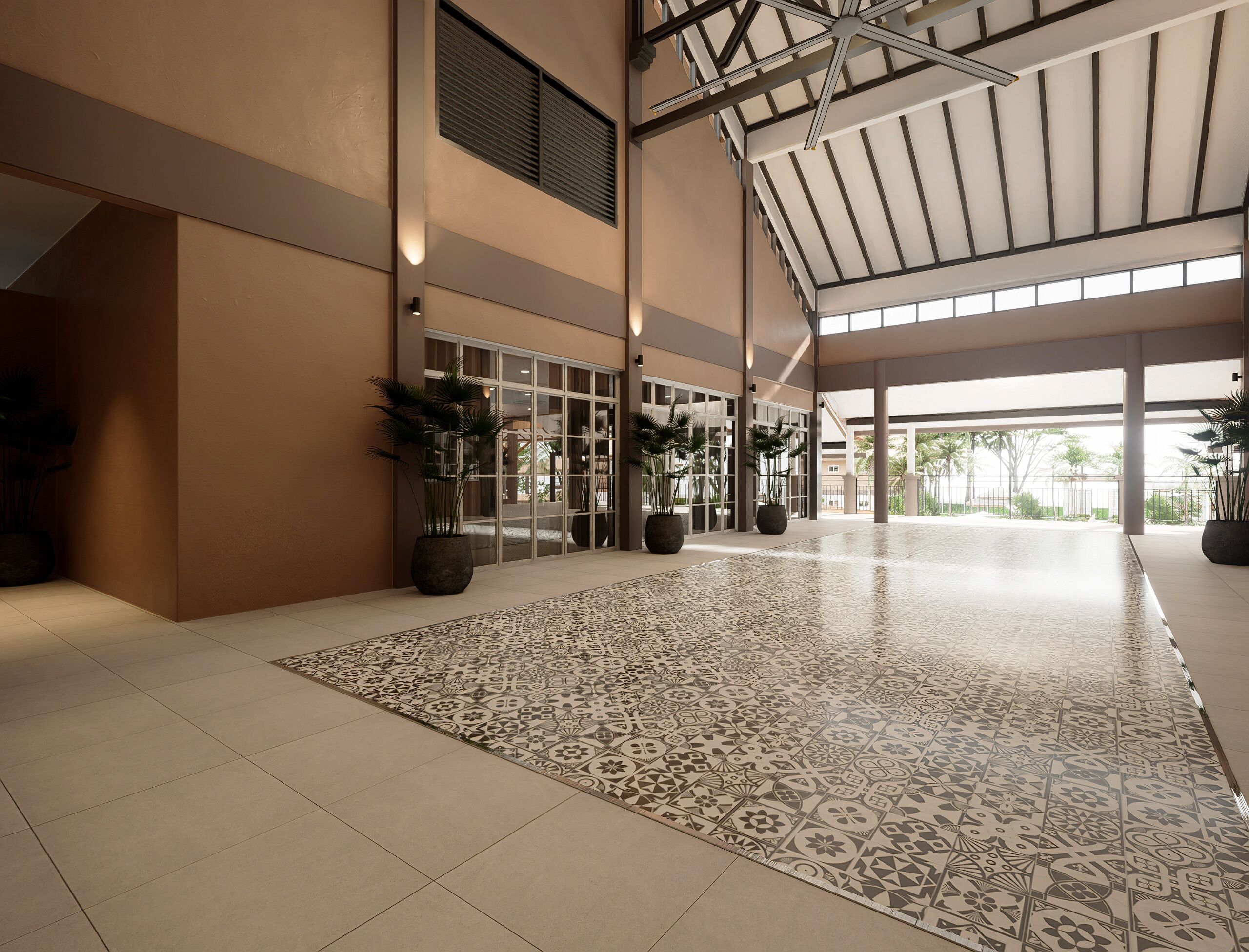 A spacious lobby with patterned flooring, large windows, and potted plants.