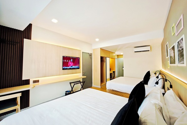 Deluxe Quadruple Room, Balcony, Garden View | In-room safe, desk, laptop workspace, blackout drapes