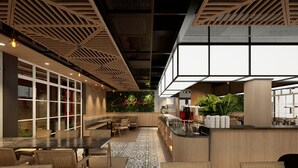 A modern cafe with a wooden ceiling, a green wall with 'Cafe House' signage, and a bar area with stools and a coffee machine. - Raia Beach Resort Port Dickson (Port Dickson)