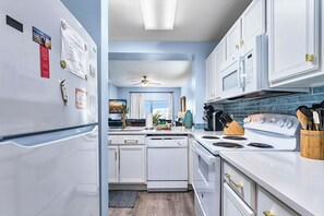 Fridge, microwave, oven, stovetop - Canal View Condo | Walk to Beach | Pool & Hot Tub (Mexico Beach)