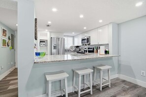 Fridge, microwave, oven, stovetop - Family-Friendly Oceanfront Condo, Pool & Patio (St. Augustine)