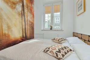 2 habitaciones, tabla de planchar con plancha, cuna de viaje y wifi 