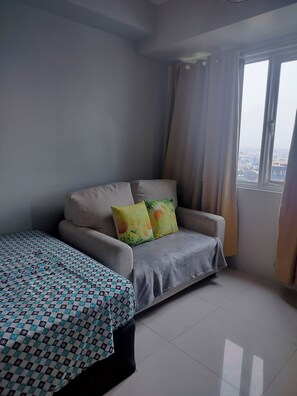 Condo, 1 Bedroom, Accessible, City View | Living room - Spacious Condo in Quezon City With City Views (Quezon City)