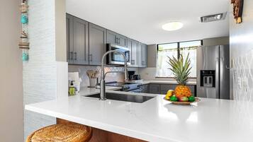 Condo, Multiple Beds, Lanai, Garden View (White Sands Village 224) | Private kitchen | Electric kettle