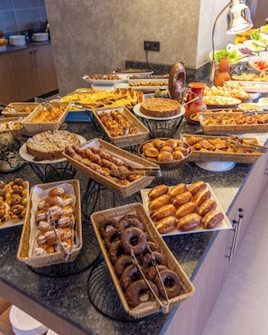A buffet with various baked goods and pastries. - Atlantis Alger Aéroport ex Ibis (Algiers)