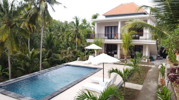 Outdoor pool, open 9:00 AM to 9:00 PM, pool umbrellas, sun loungers