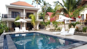 Outdoor pool, open 9:00 AM to 9:00 PM, pool umbrellas, pool loungers