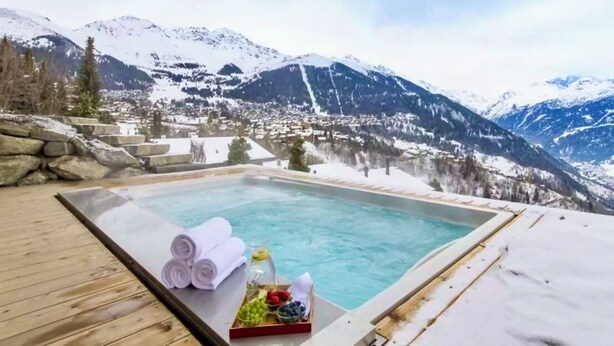 A hot tub with a mountain view, towels, and fruit. - CHALET NEIGE - Six Bedroom Chalet, Sleeps 12 (Verbier)